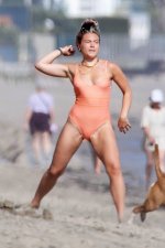 florence-pugh-seen-wearing-an-orange-swimsuit-while-enjoying-a-beach-day-with-boyfriend-zach-b...jpg